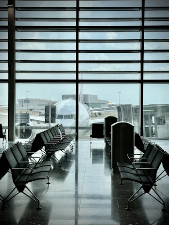 Minimalist airport terminal interior featuring sleek lines and muted colors.