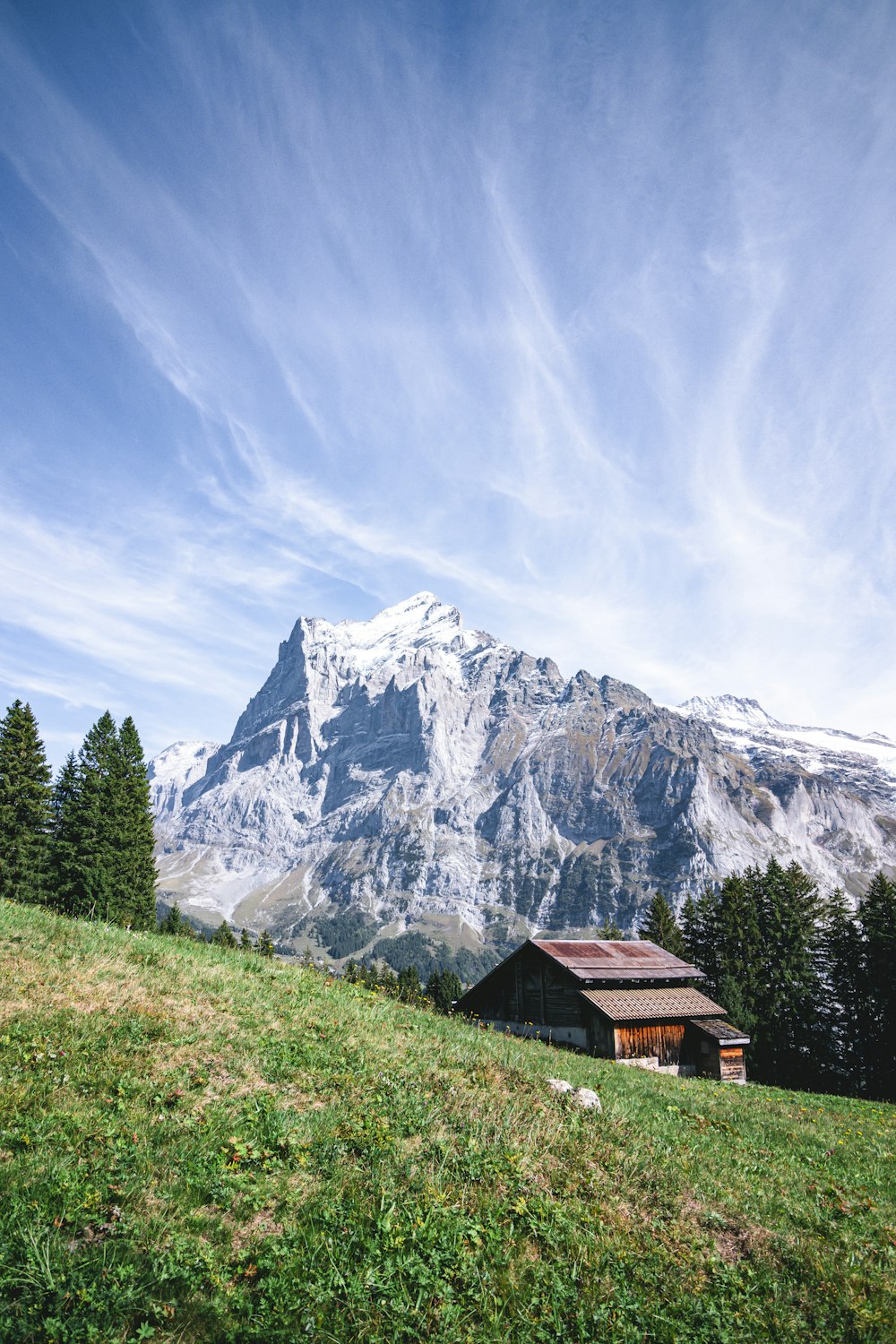 a house in front of a mountain