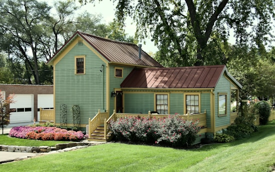 a green house with a red roof