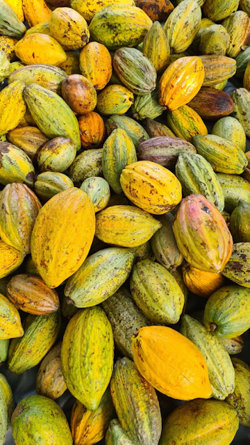 a pile of yellow and green fruit