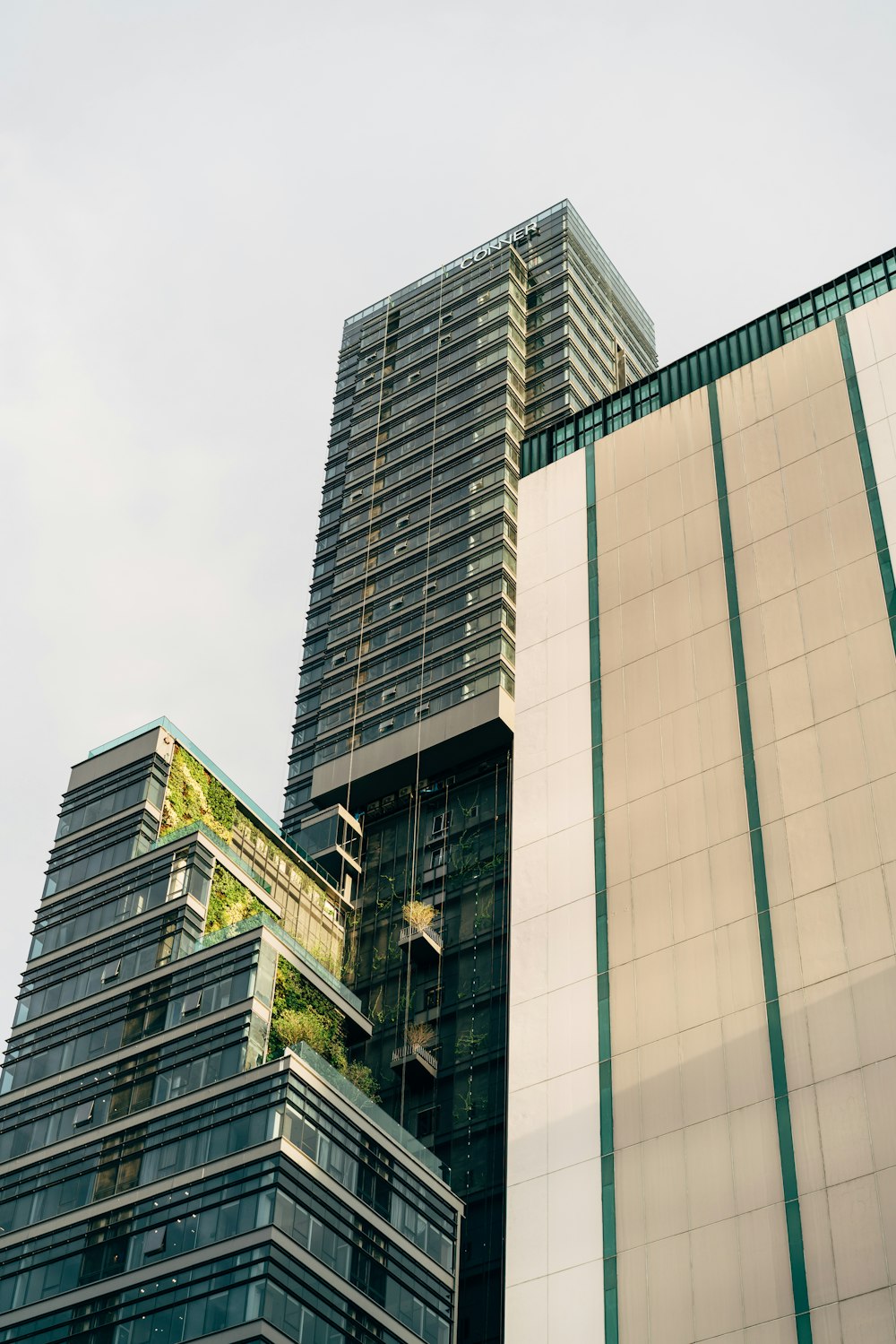 a tall building with a green roof