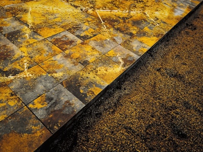 A close-up shot showing smooth application of yeppoli's premium tile adhesive on a tile surface.