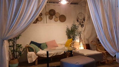 A cozy indoor space with cushions and calming decor.