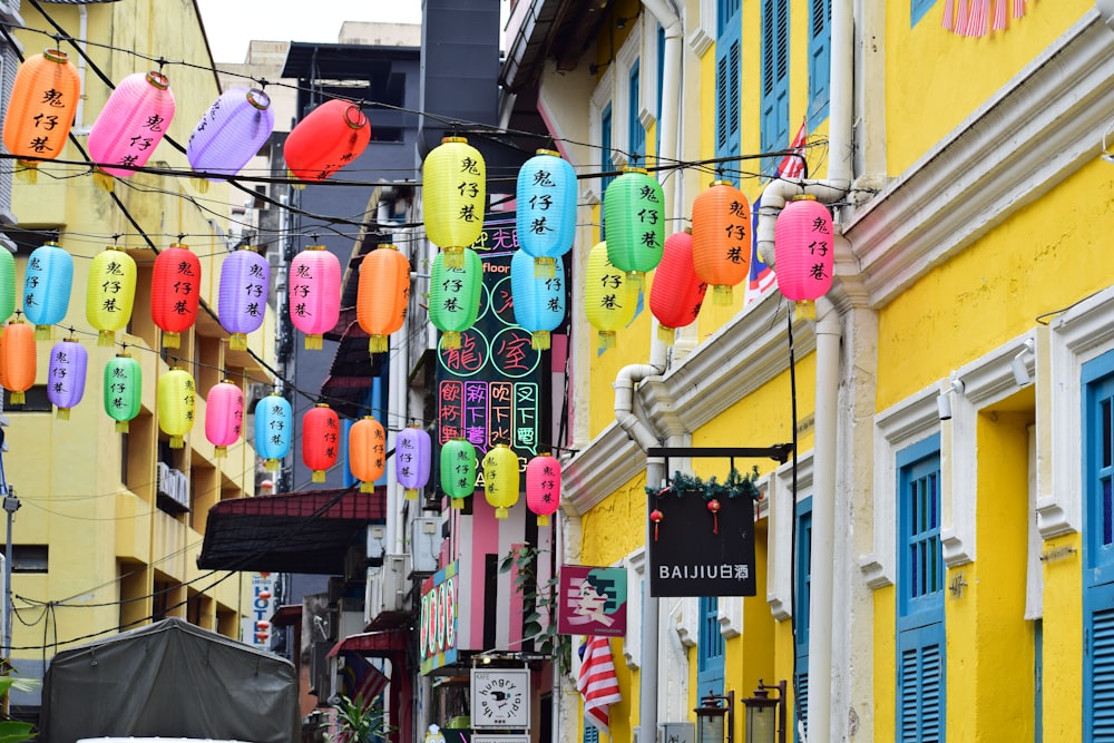 a row of colorful lanterns from a building