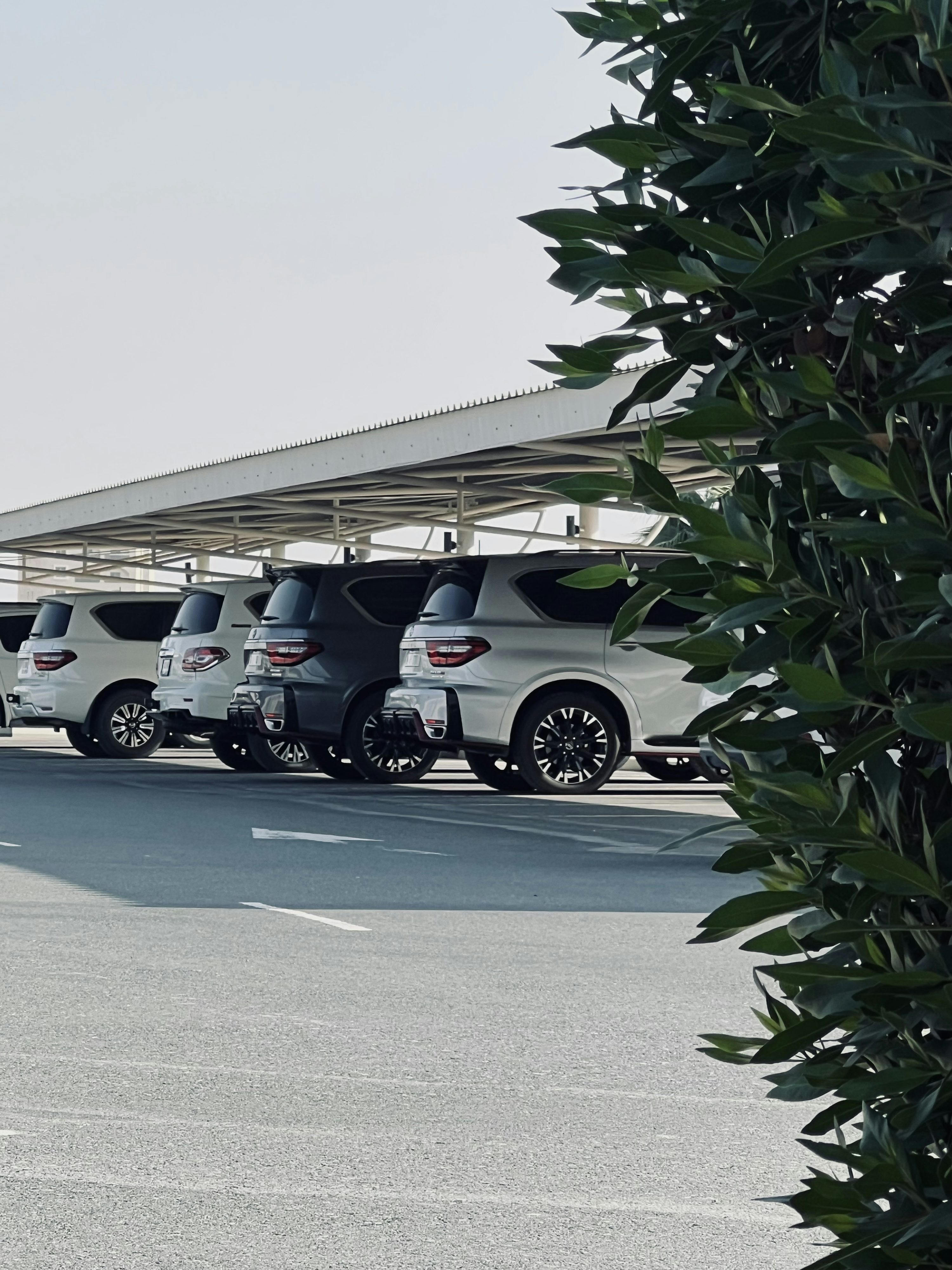 a group of cars parked on a road