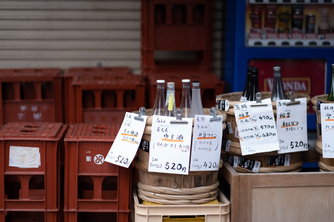 a group of bottles on wooden crates,