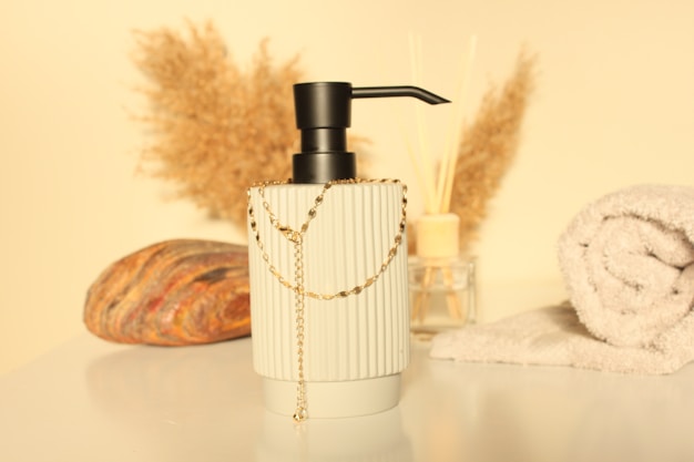 a glass vase with a gold chain