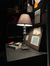 A professional lawyer's desk with legal books and a warm lamp light.