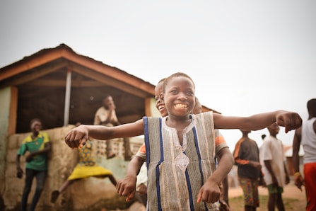 a boy with his arms out