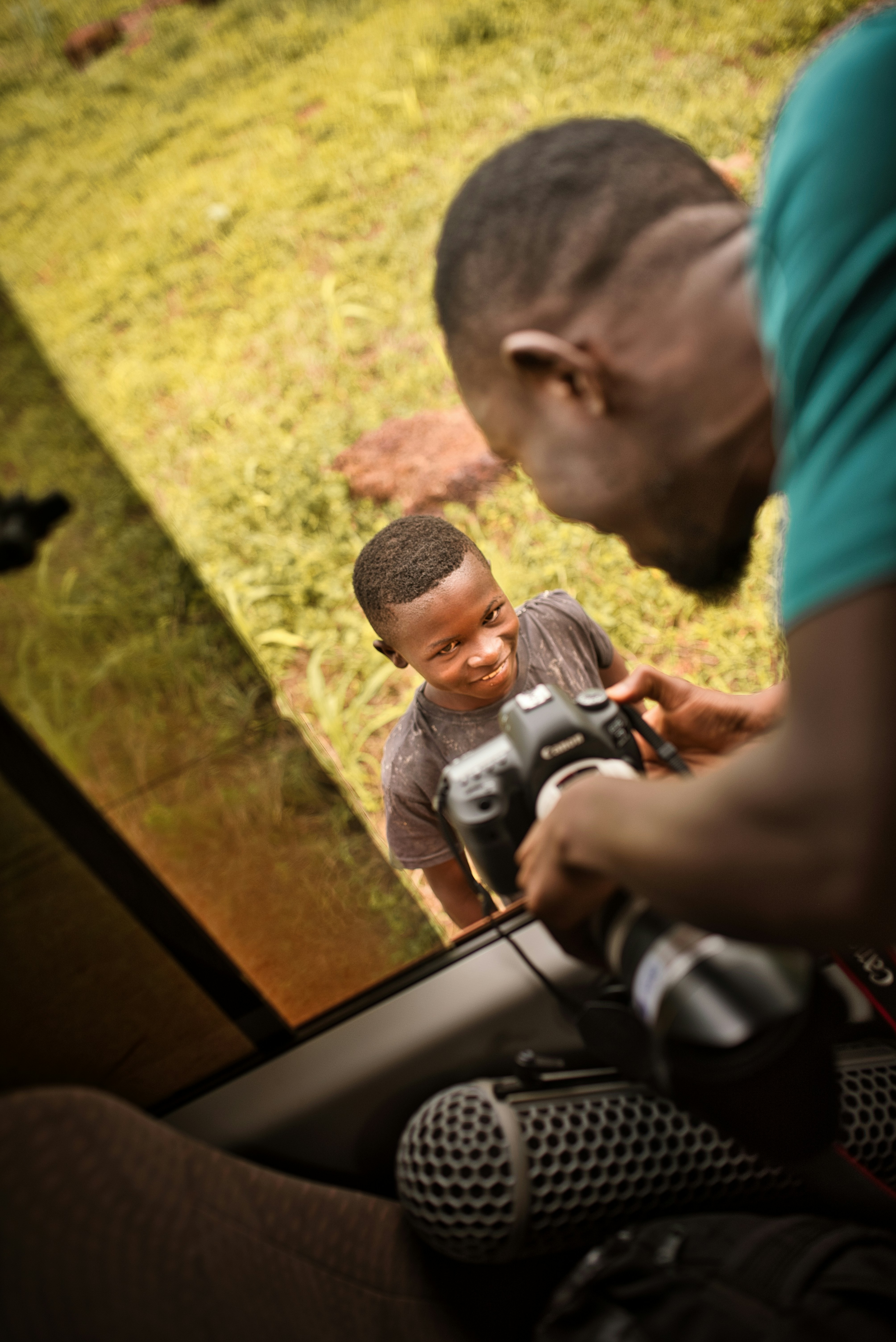 a man and a woman looking through a camera