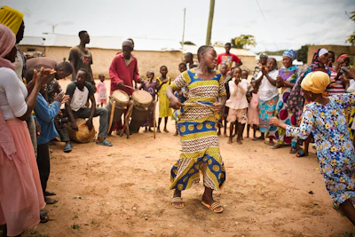 A vibrant scene of people dancing in a circle, celebrating faith.