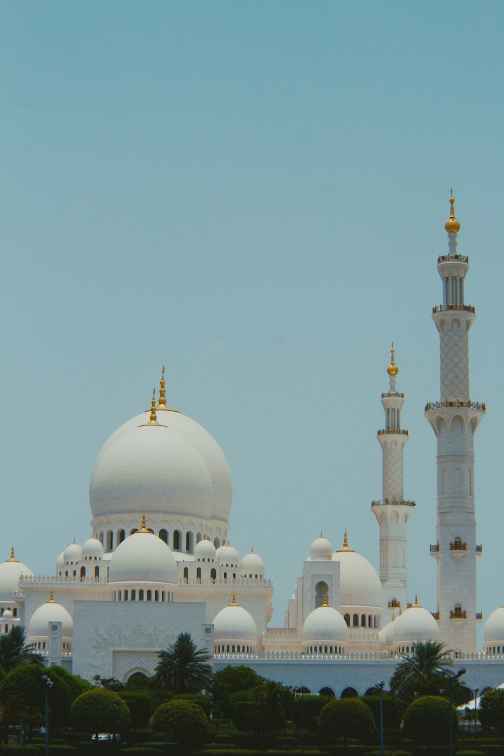 a large white building with domes and towers