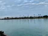 A serene view of the lagoon at Barra da Tijuca with calm waters reflecting the sky.