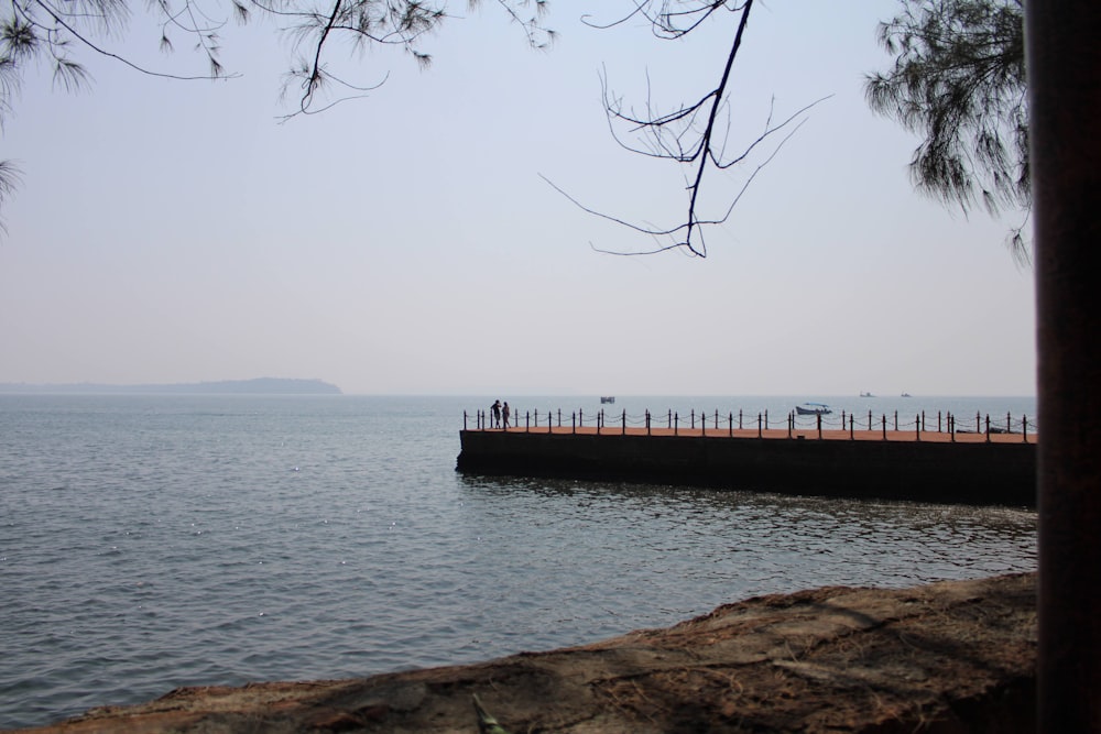 a pier with people walking on it