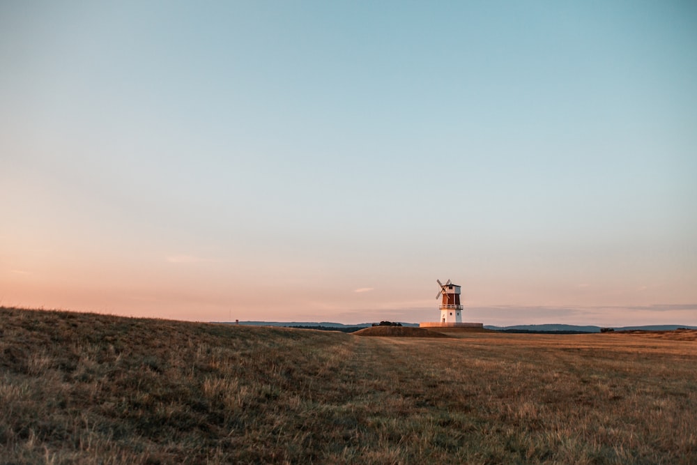 a lighthouse on a hill