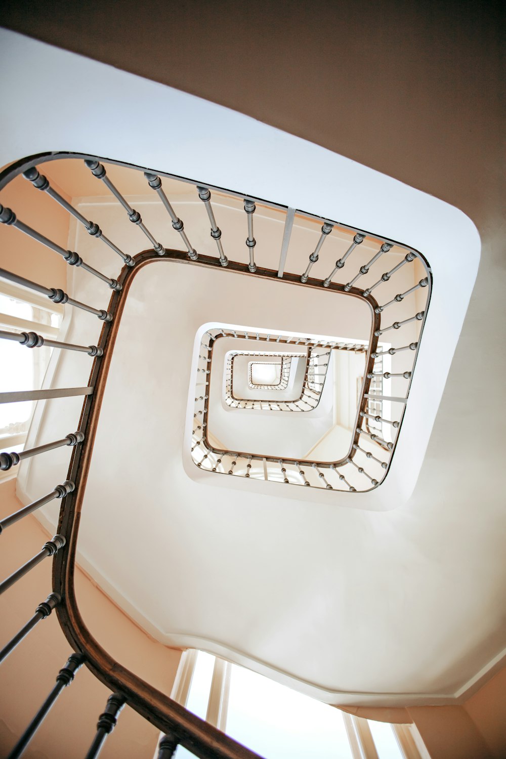 a spiral staircase with a circular light