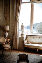 a room with a bed and a lamp