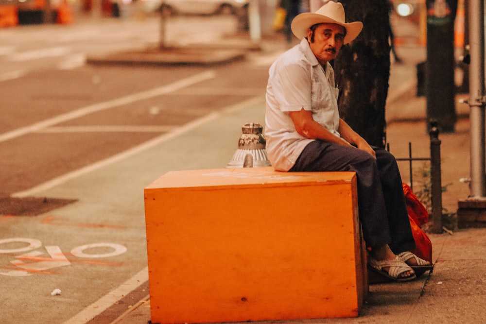 a man sitting on a suitcase