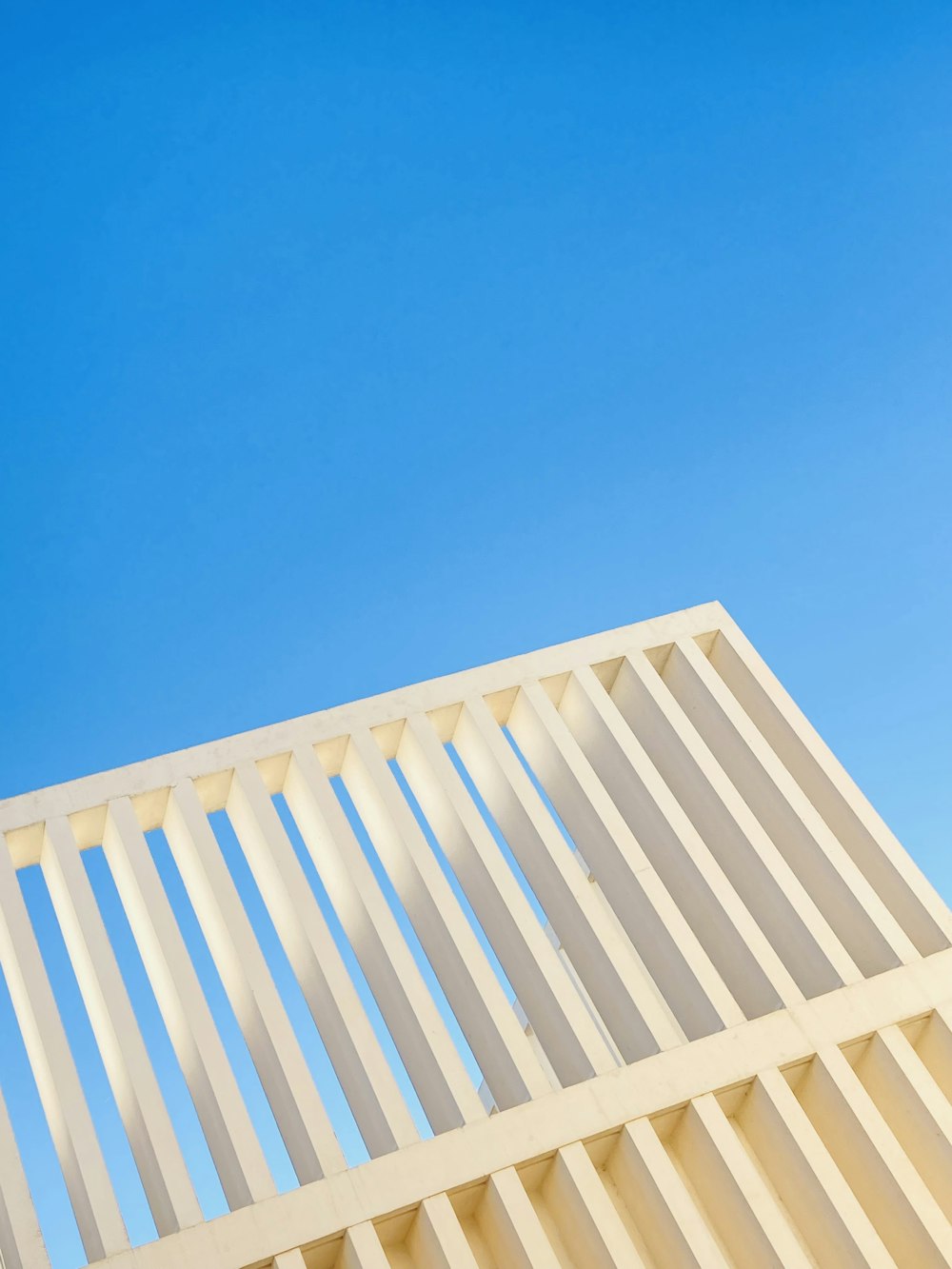 a white building with a blue sky