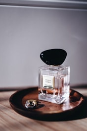 a glass jar with a black lid