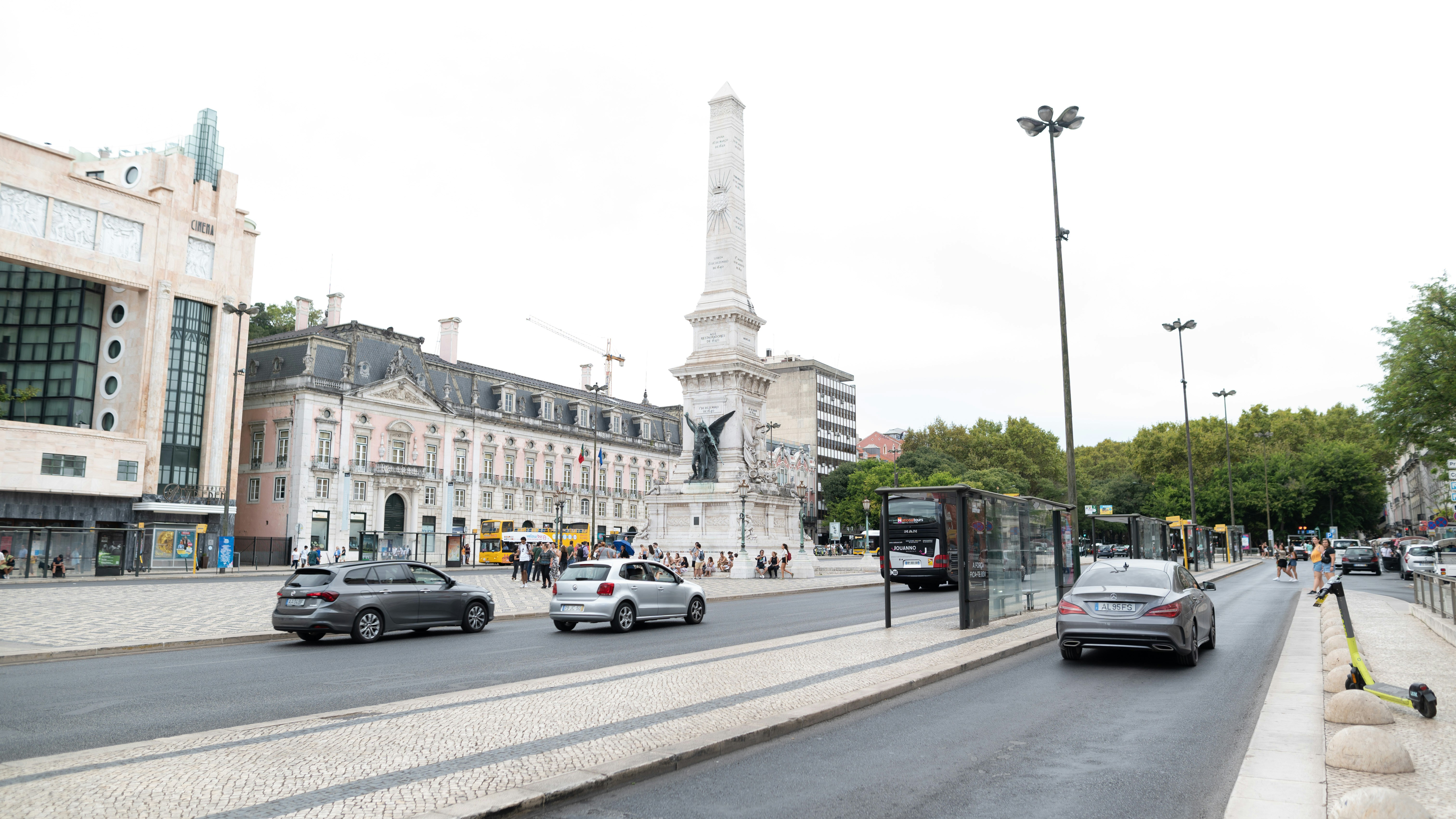 a street with cars and buildings on the side
