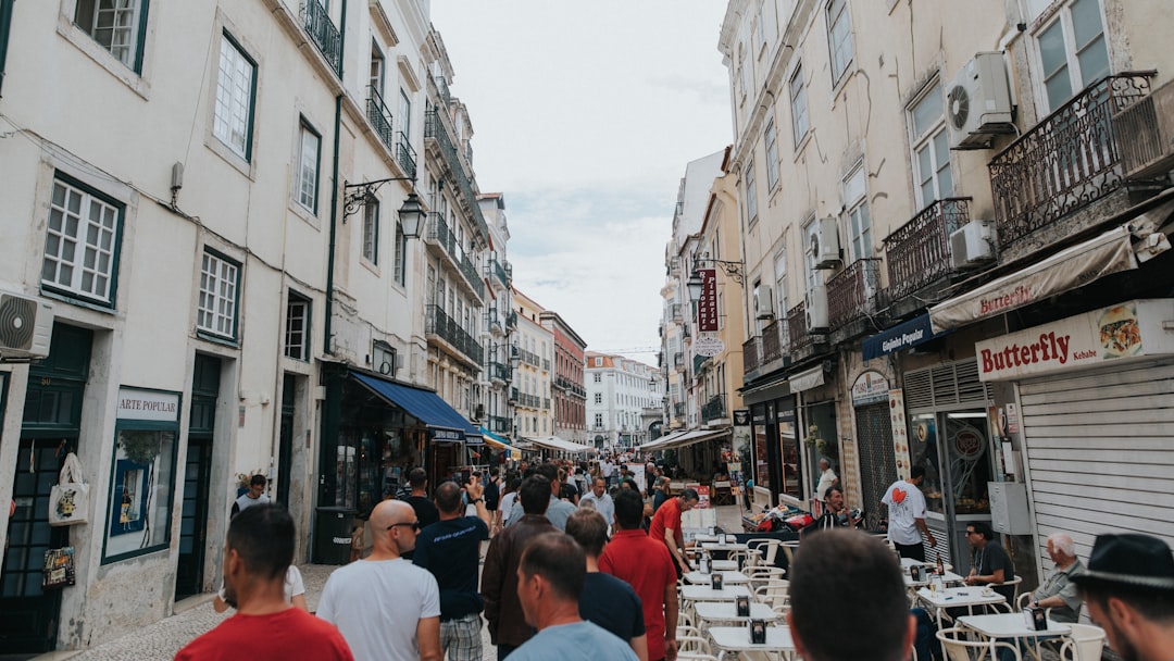 a group of people walking in a city,
