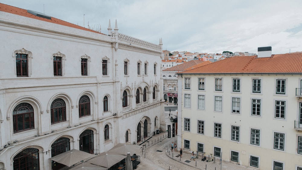 a group of buildings with people walking around