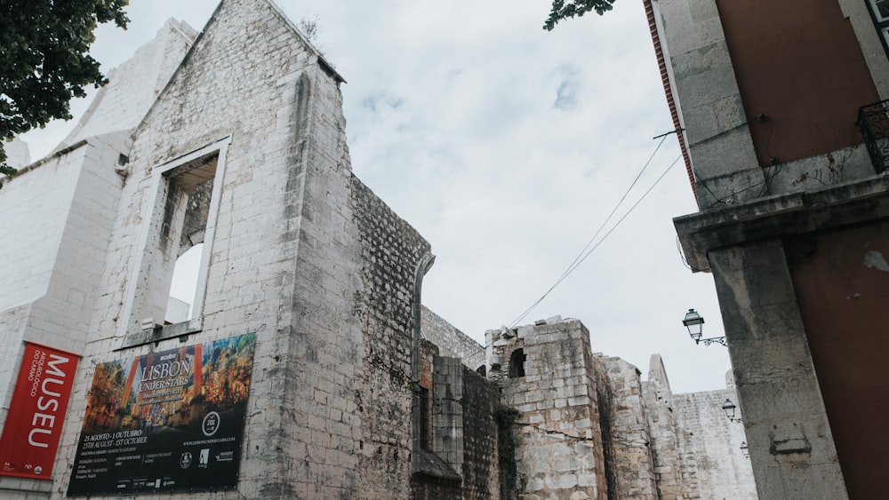 a stone building with a sign on it