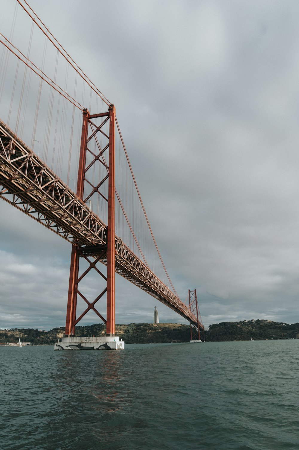 a large red bridge over water