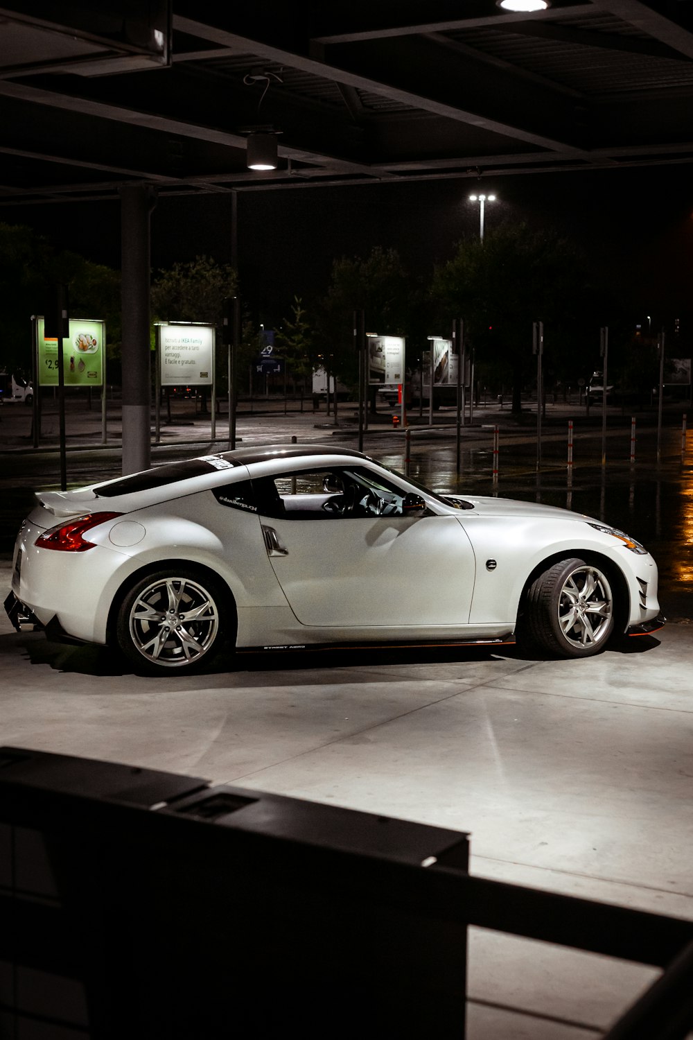 a white car parked in a parking lot