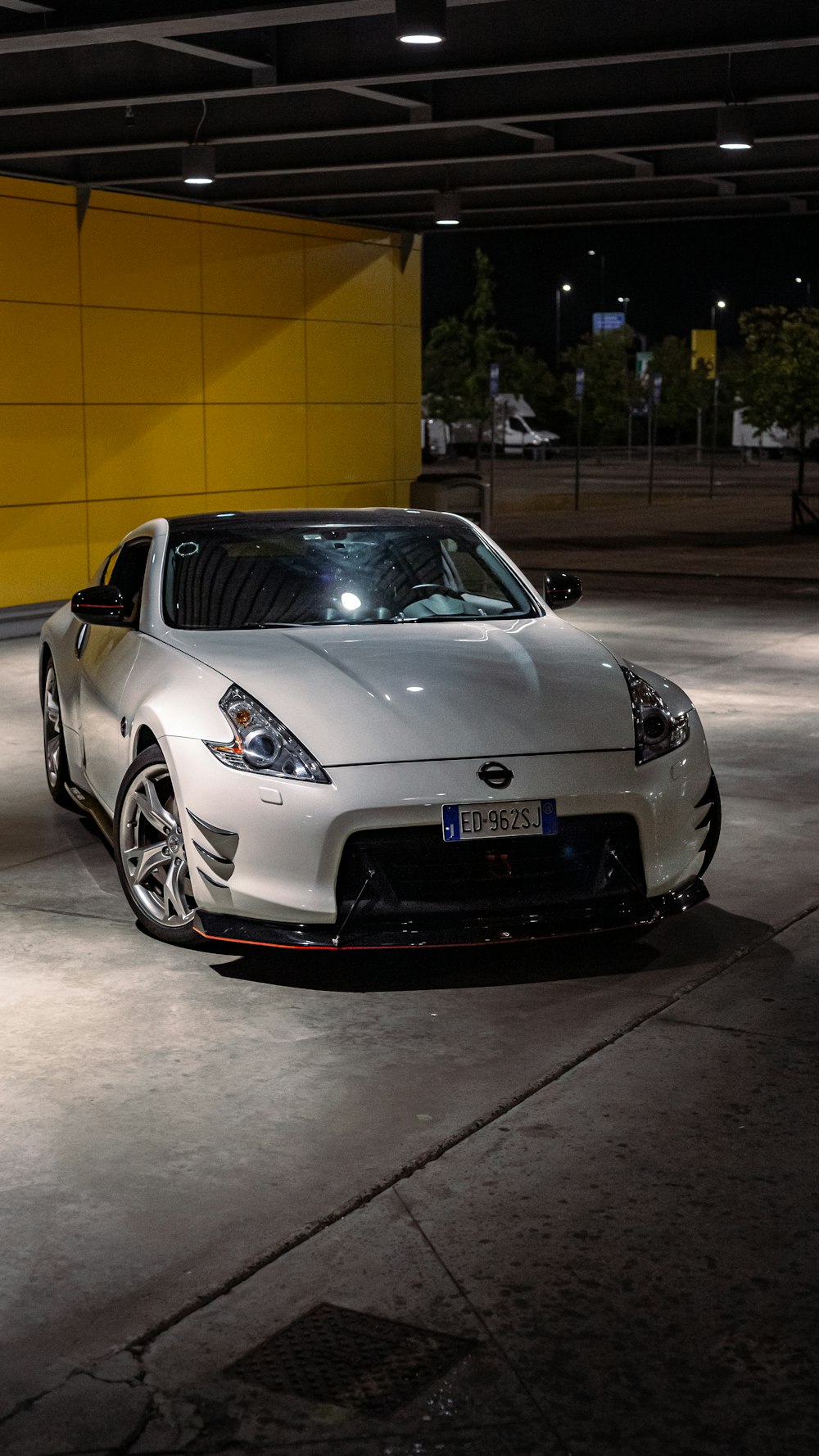 a white car parked in a parking garage