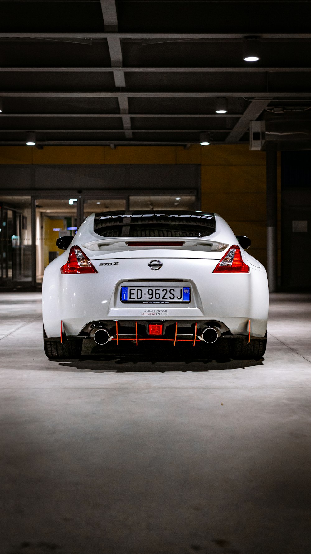 a white car parked in a garage