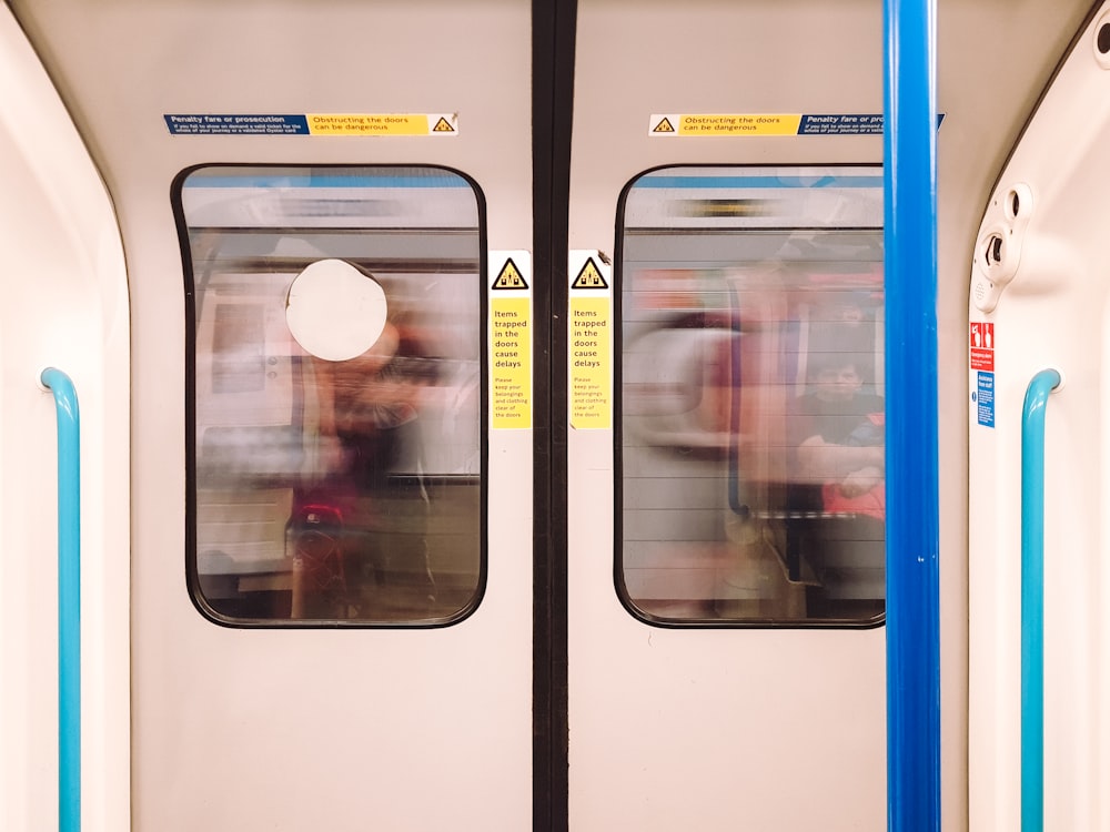 a person in a white hat in a train