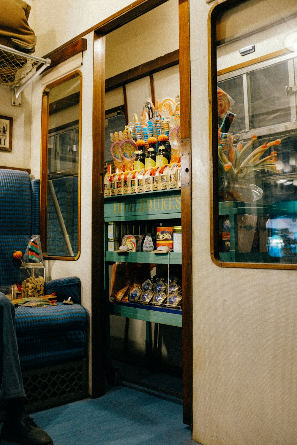 a shelf with bottles of alcohol