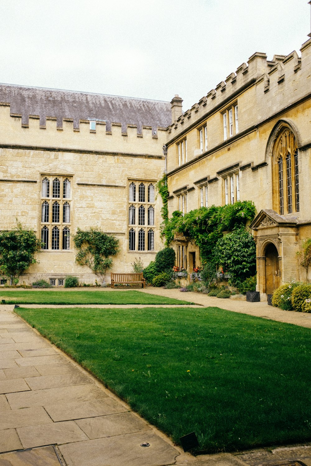 a large building with a lawn in front of it