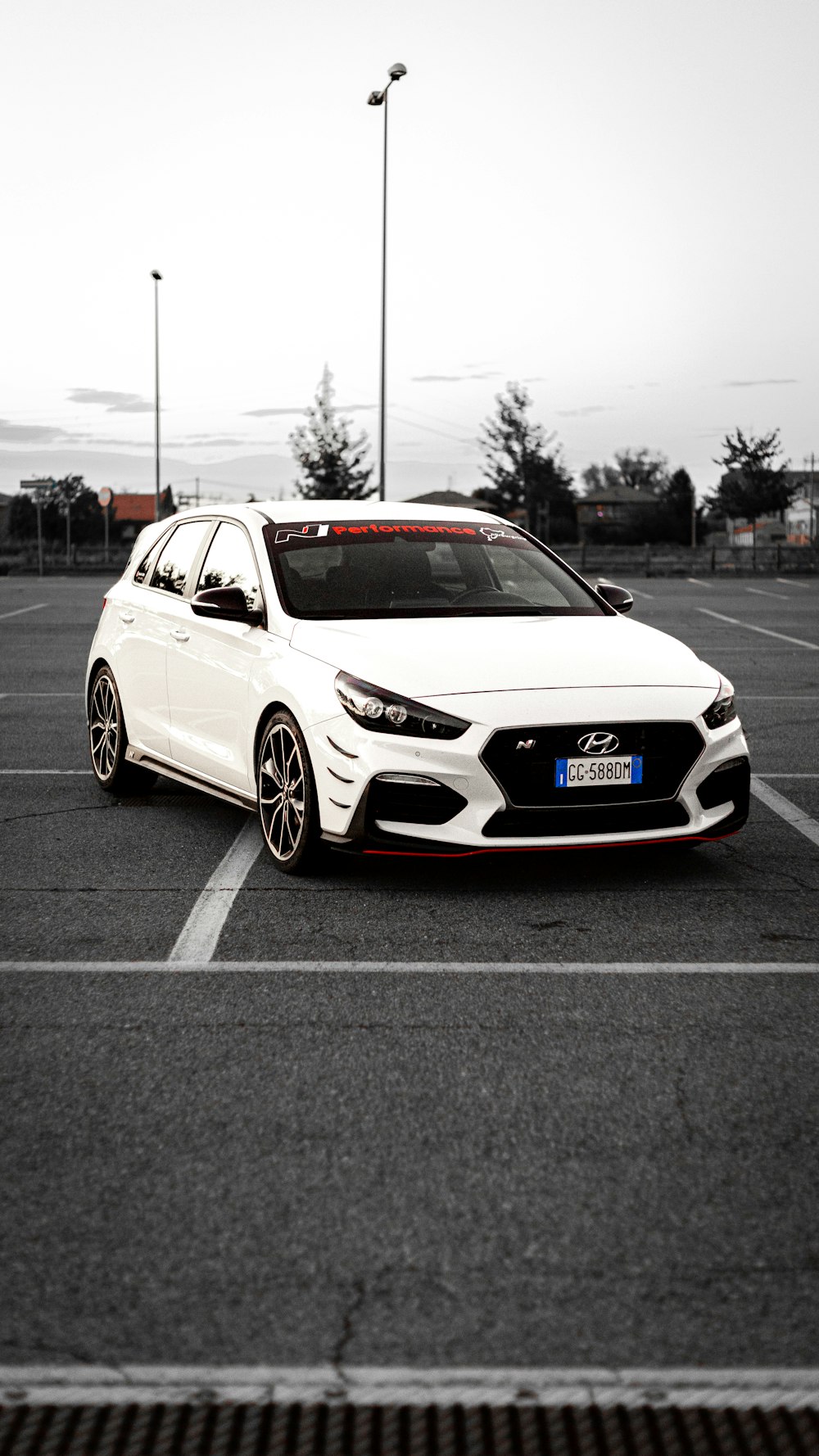 a white car parked in a parking lot