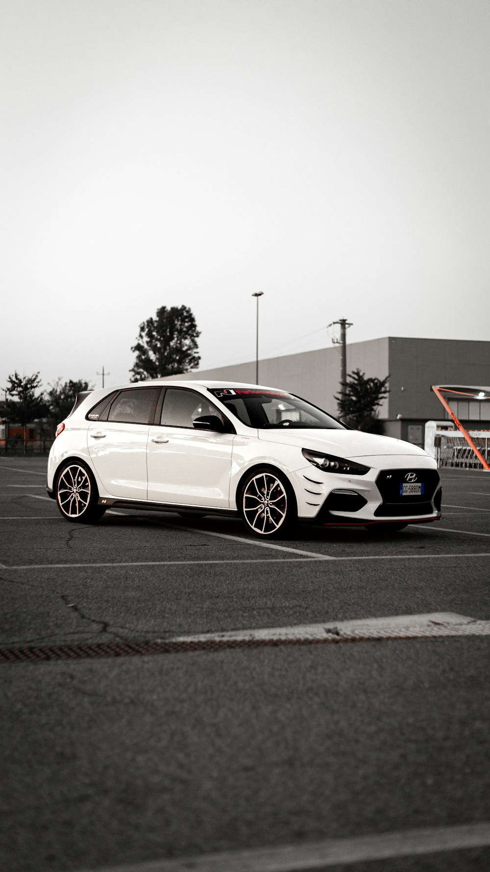 a white car parked in a parking lot