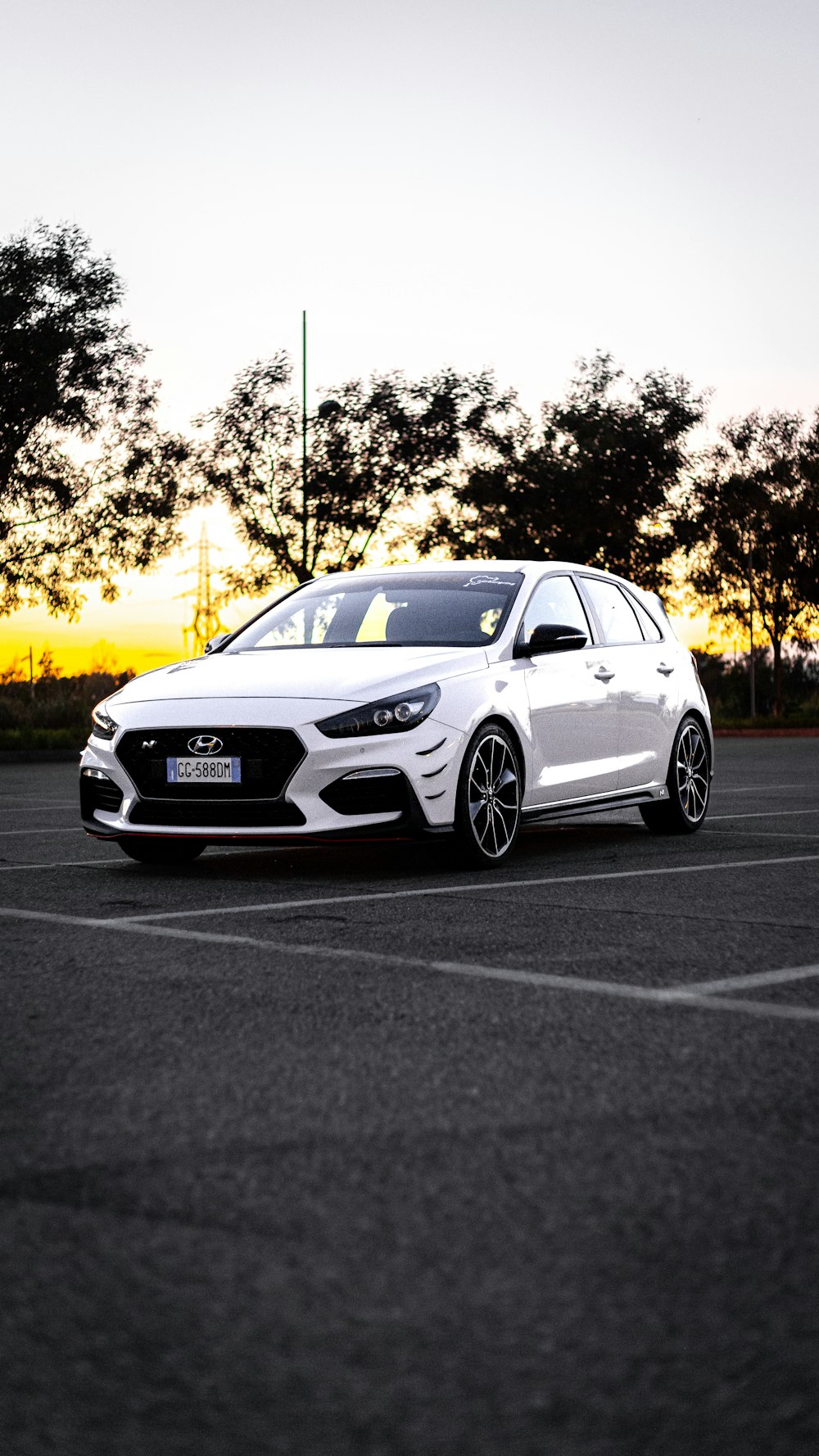 a white car parked in a parking lot