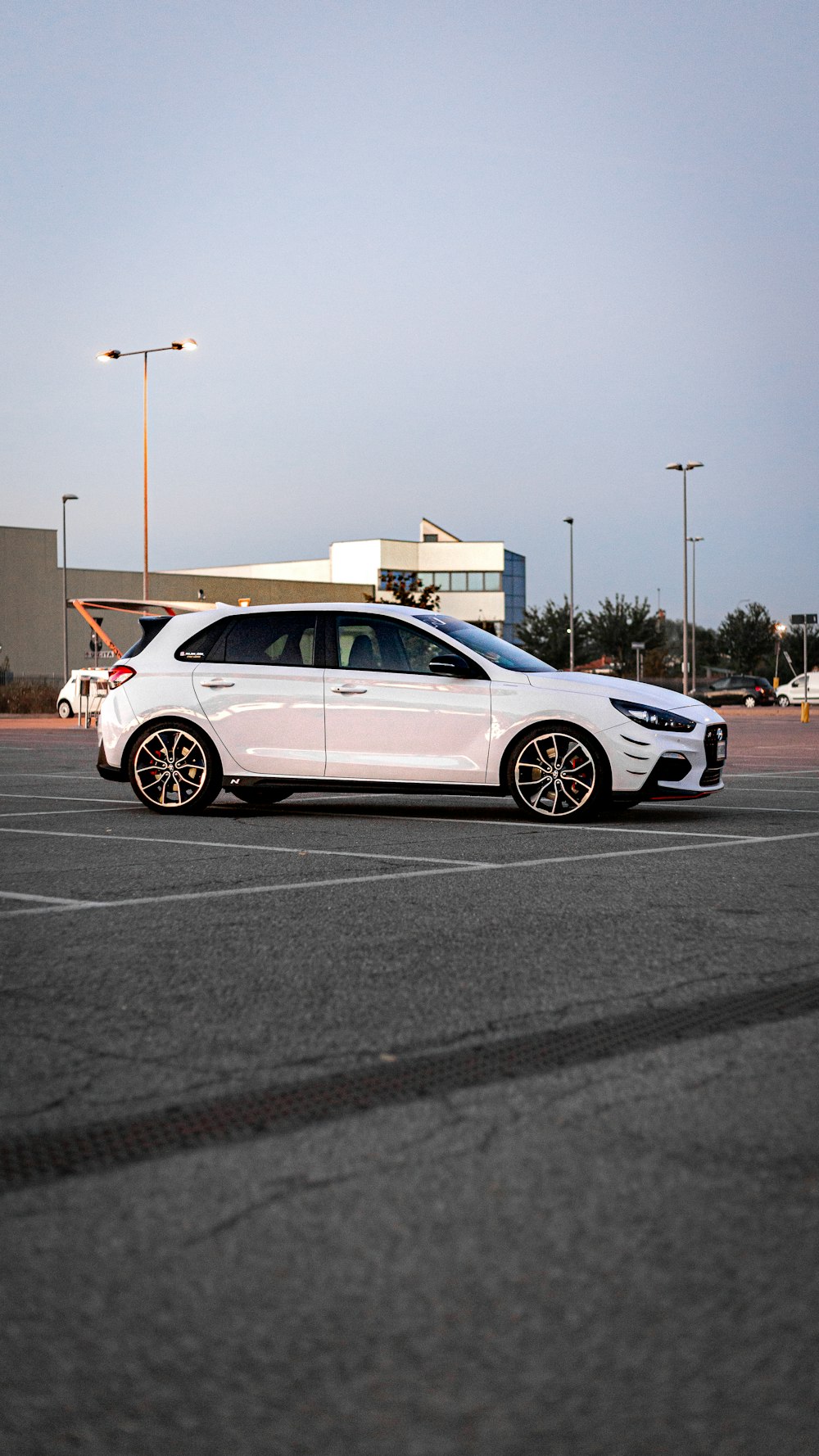 a white car parked in a parking lot