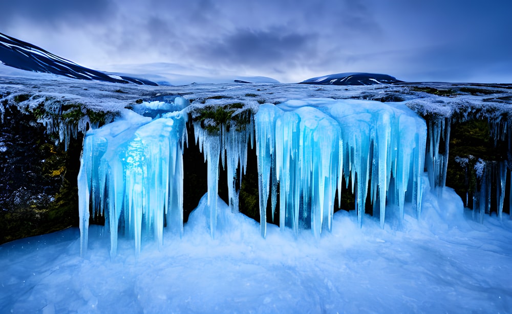 a group of waterfalls in a snowy place