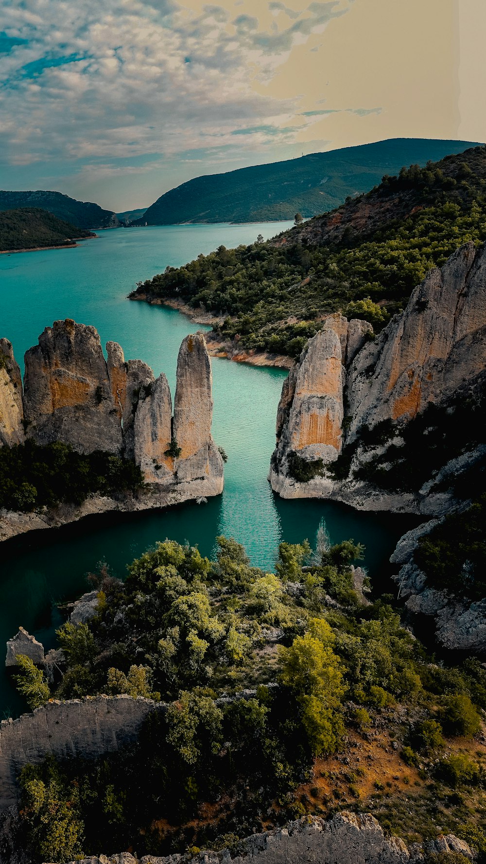 a cliff with a body of water below