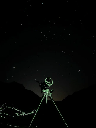 A vibrant close-up of a vintage telescope pointing towards a starry night sky.