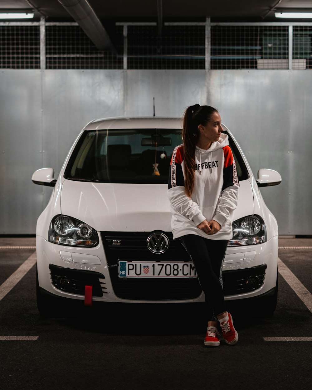 a person riding on the back of a car