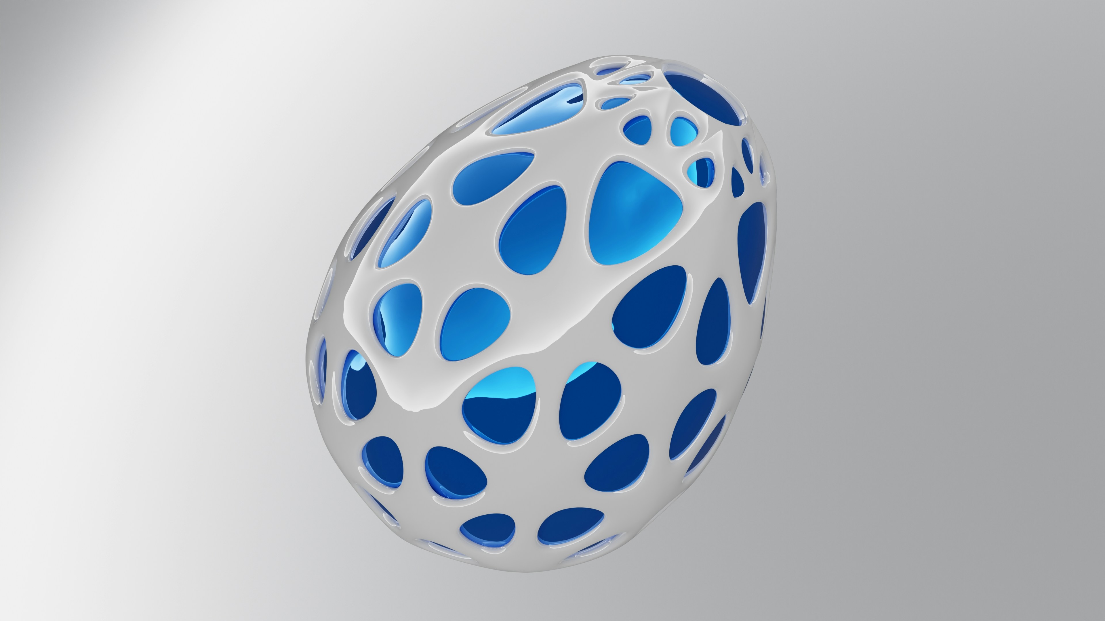 Egg-shaped metallic voronoi item with a blue core for artistic purposes.