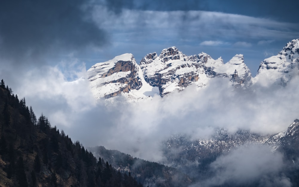 a mountain with clouds below