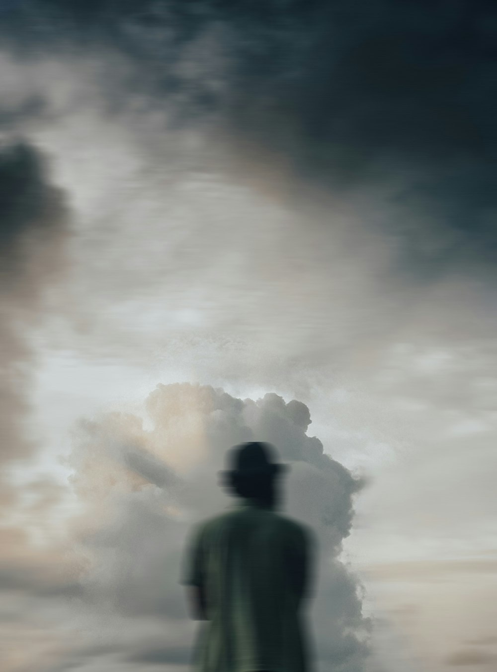 a person standing in front of a cloud of smoke