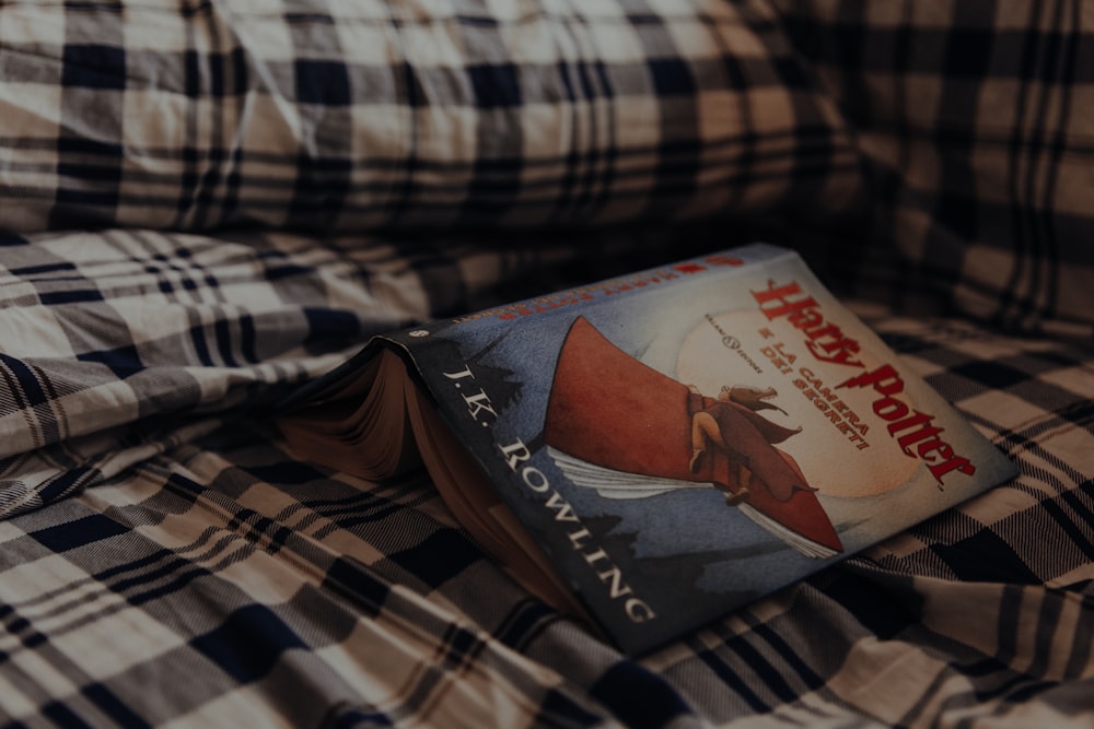 a pair of red and white boxes on a bed