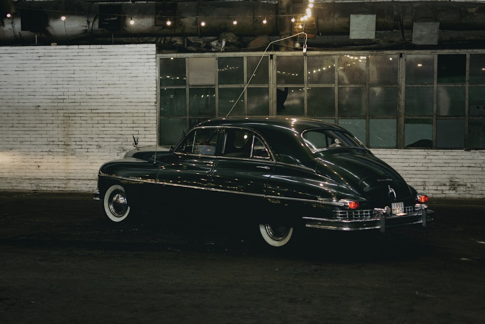 a black car parked in a garage