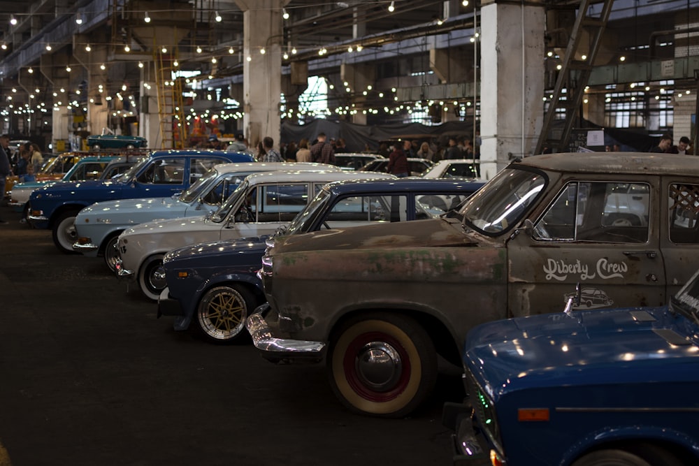 a group of cars parked in a building