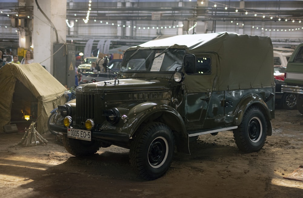 a black jeep parked in a garage